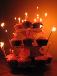SX17138 Jen's cupcake birthday cakes with candles lit.jpg